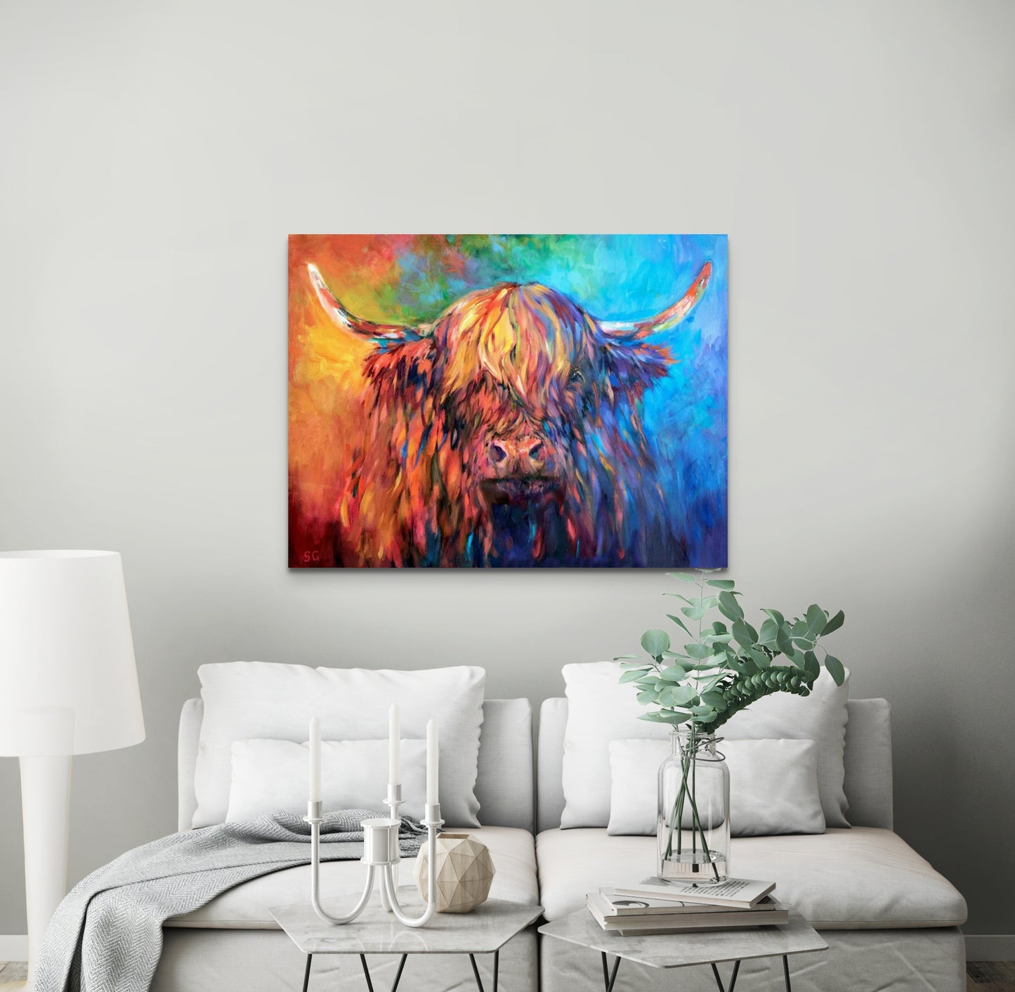 highland cow picture in bright colours in a white room
